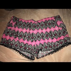 pink and black print shorts
